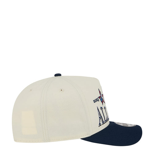 Cream baseball cap with navy brim and side embroidery, New Era flag at back.