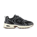 Black mesh running sneakers, gray overlays, large N logo, beige midsole, gum outsole