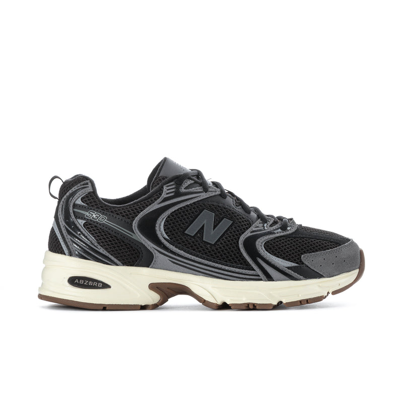 Black mesh running sneakers, gray overlays, large N logo, beige midsole, gum outsole