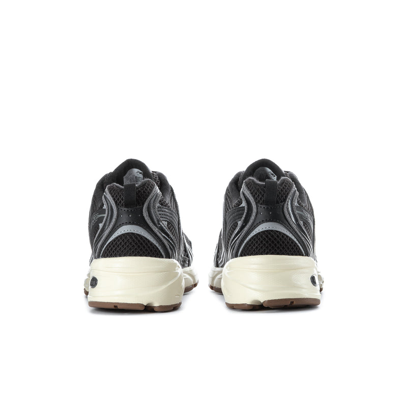 Black mesh sneakers with beige heel panel, cushioned collar, rear branding detail