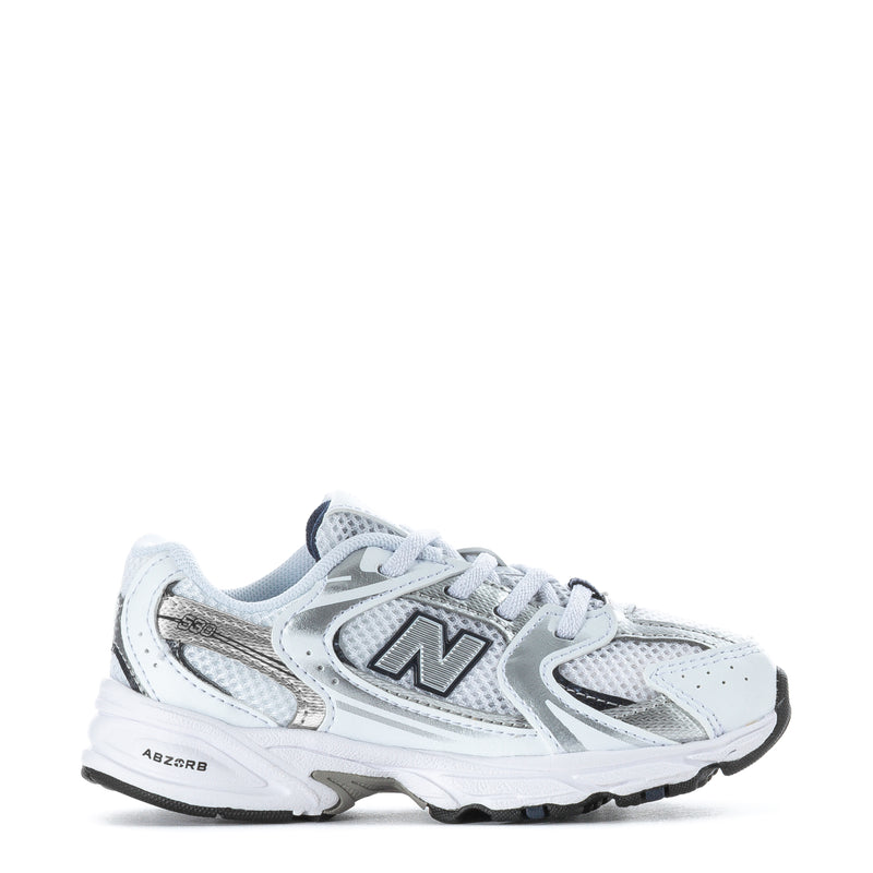 Toddler white and navy New Balance sneaker with lace-up and N logo, gray sole