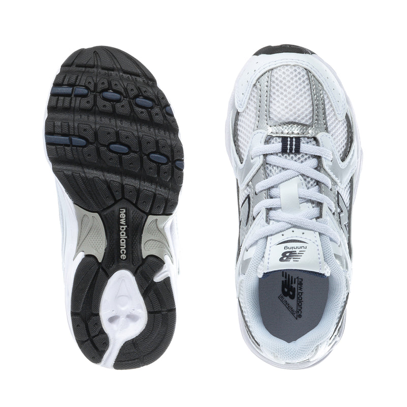 Toddler sneakers with white uppers and dark outsole tread, laces and mesh tongue