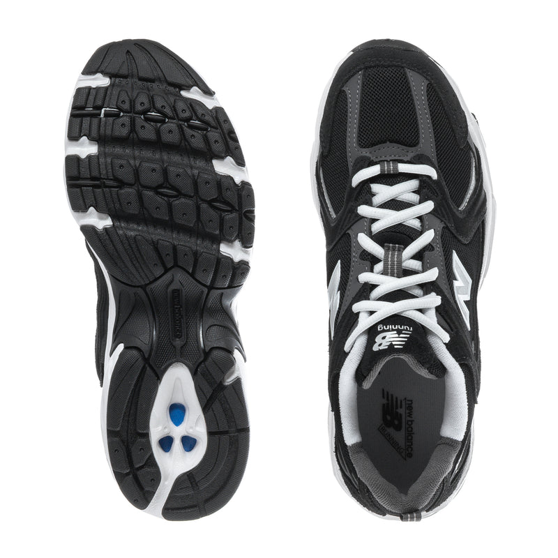 Wide women’s athletic sneakers, outsole and inner side view in black with white sole