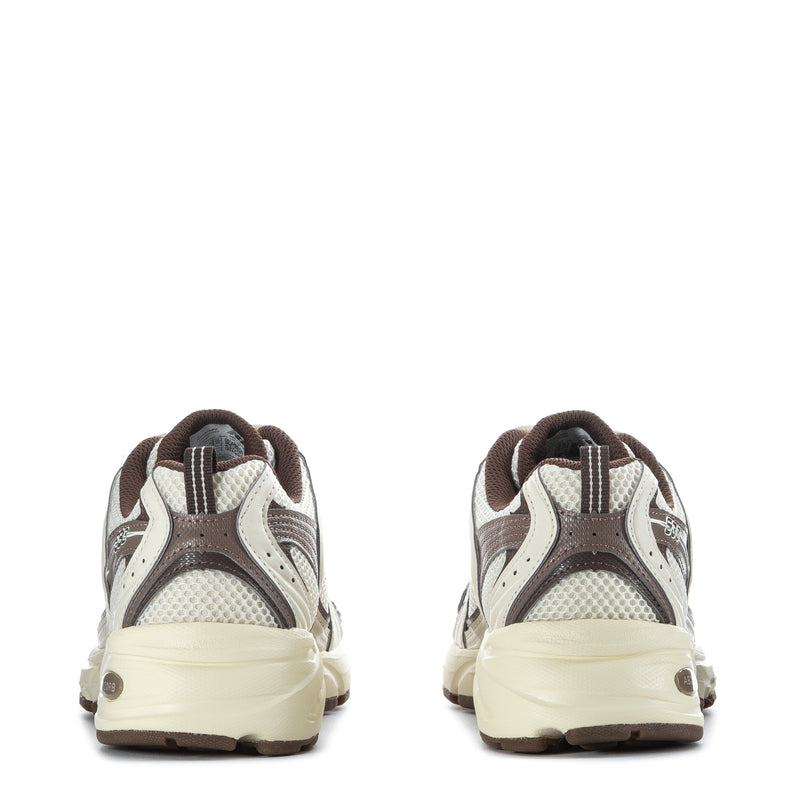 Back view of lace-up sneakers with cream heel, gray mesh, brown collar and pull tab