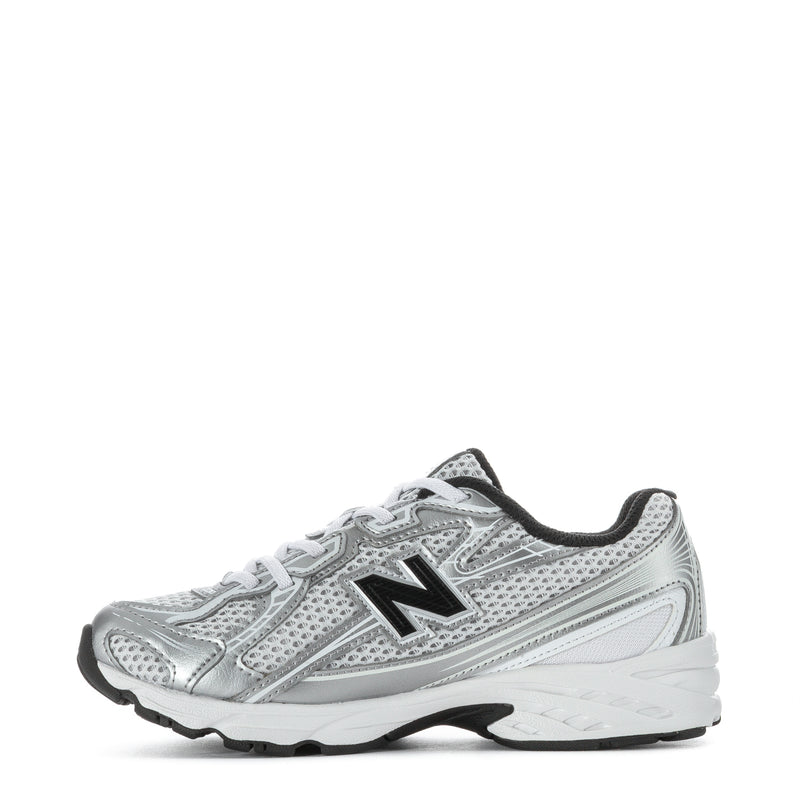 Kids silver metallic running sneakers, side view with black New Balance N and laces