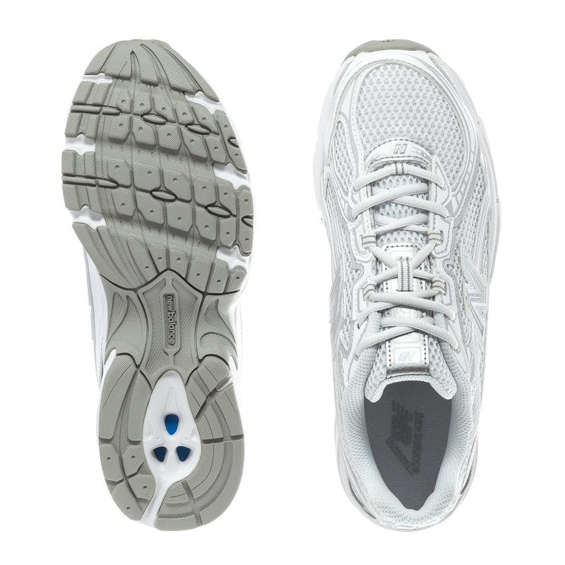 Women's sneaker outsole and heel view, white mesh upper with rubber tread