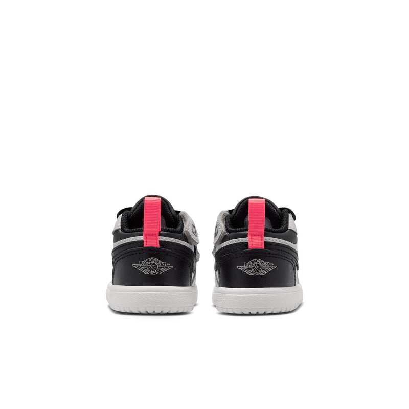 Kids low-top sneakers with black heel and red pull tab, white midsole trim