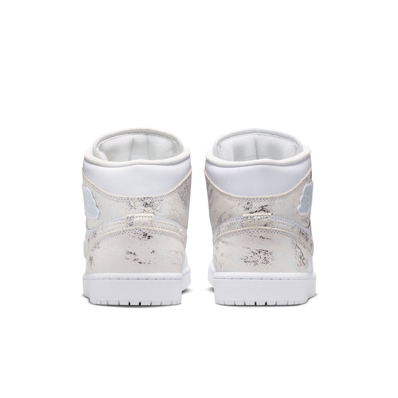 Men's white mid-top sneakers with speckled heel overlays and padded collars