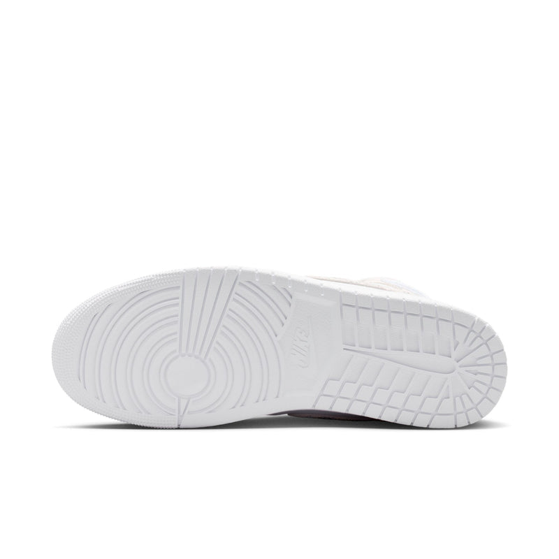 White rubber outsole with tread pattern on men's mid-top sneakers