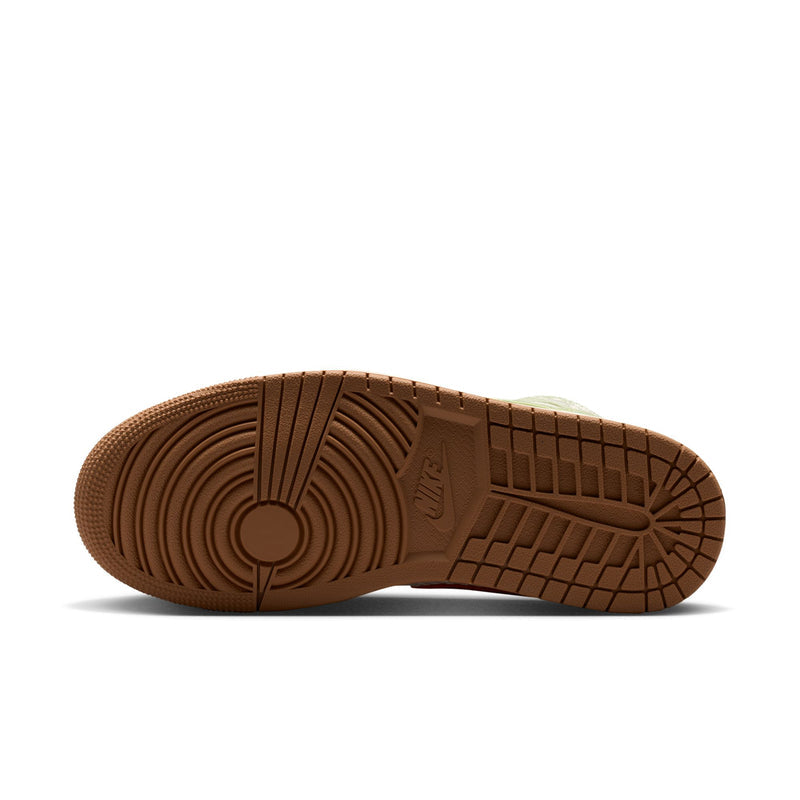 Brown rubber outsole with circular traction pattern and grid tread for grip