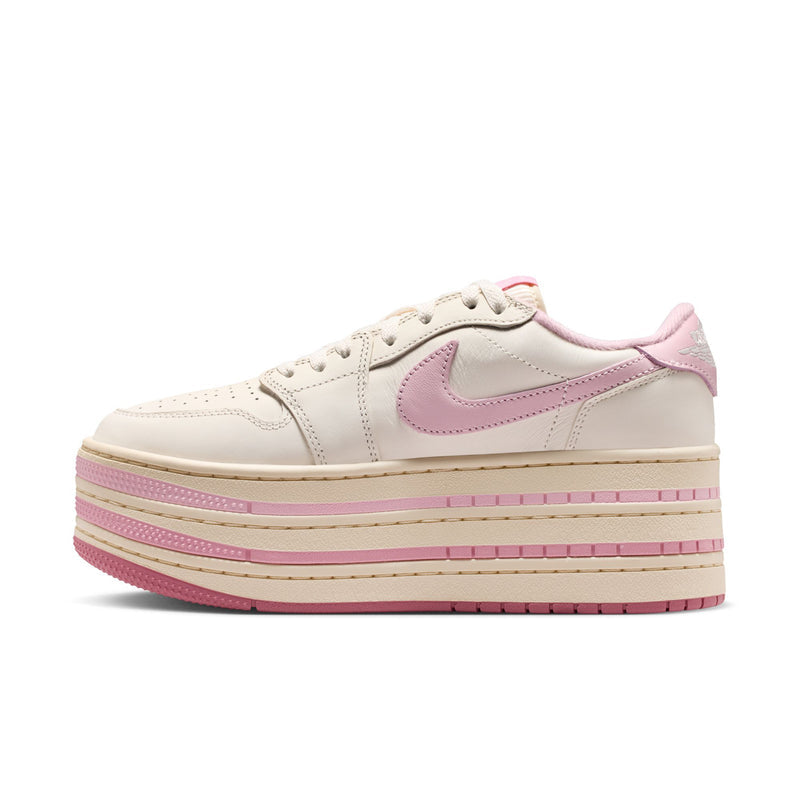 Pale ivory low-top sneaker with pink swoosh detail and stacked stripe platform