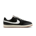 Men's black low-top sneakers with white Swoosh and lace-up design, gum sole