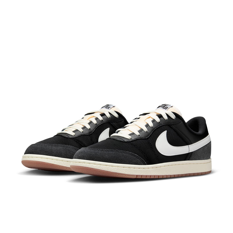 Pair of men's black low-top sneakers with white Swoosh and lace-up, gum outsole