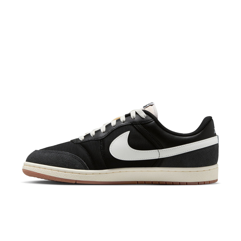 Men's black low-top sneakers with white Swoosh, lace-up front, tan gum sole