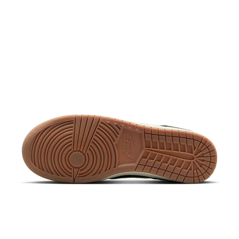 Men's sneaker outsole with patterned rubber tread and brown gum edge