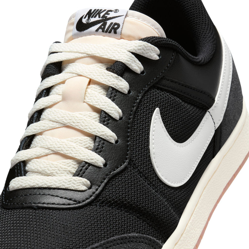 Men's black sneakers with white Swoosh, lace-up front, Nike Air on tongue