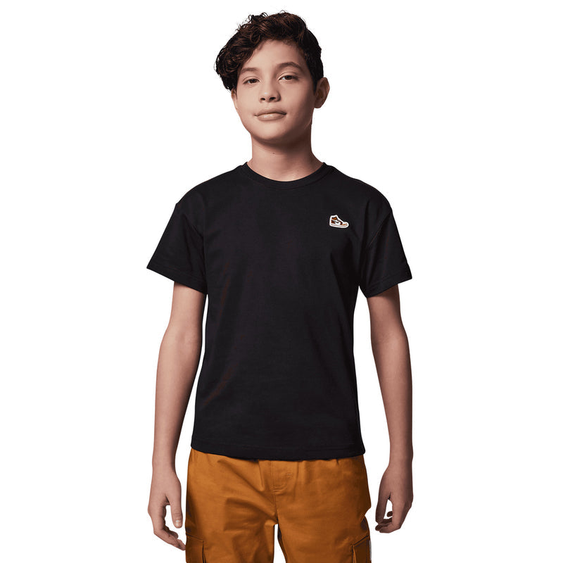 Youth black crewneck t-shirt with sneaker logo patch on left chest
