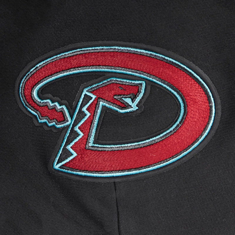 Embroidered red-and-teal D logo patch on black hoodie