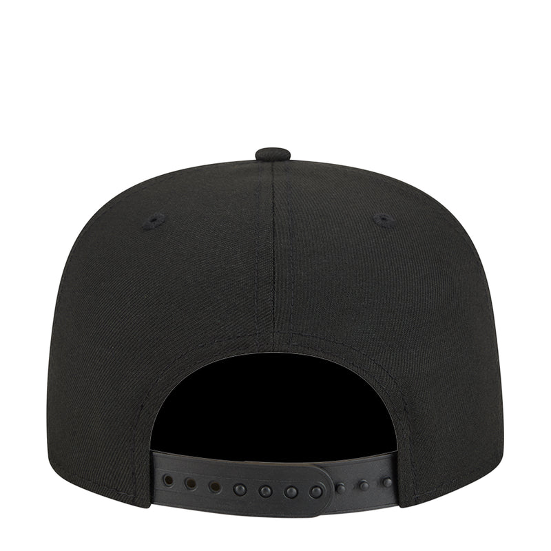 Black snapback cap back view with adjustable strap and metal eyelets