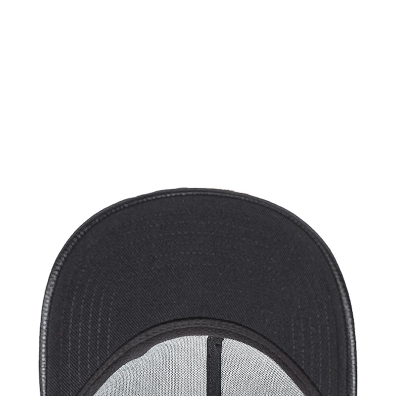 Black snapback cap front panel close-up with stitched edge and textured fabric