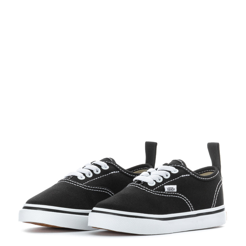 Pair of black toddler low-top lace-up sneakers with white laces and rubber sole