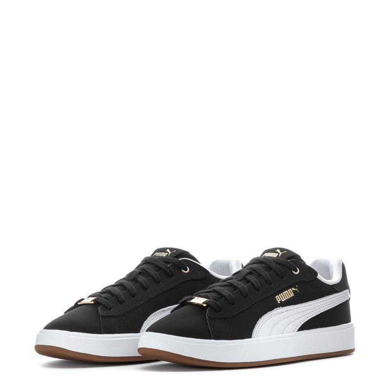 Pair of black Puma sneakers with white mid-panel stripe and white outsole trim