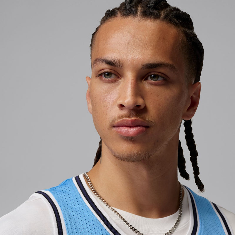 Light blue sleeveless mesh jersey with white-and-navy trim crew collar