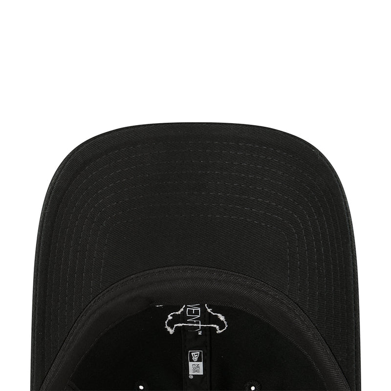 Black cap underside view with small Bulls outline patch on the inner brim