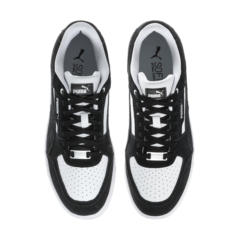 Pair of black-and-white lace-up sneakers with perforated toe and Puma branding.