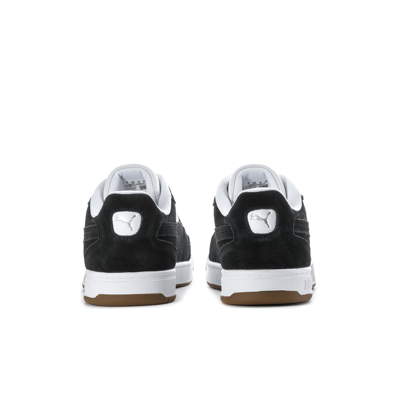 Back view of black sneakers with white heel accents and Puma logo badge.