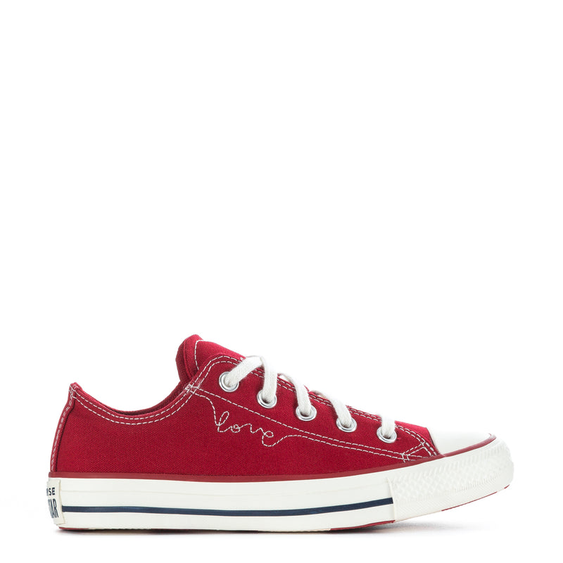 Womens red low-top canvas lace-up sneaker with white toe cap and navy midsole stripe