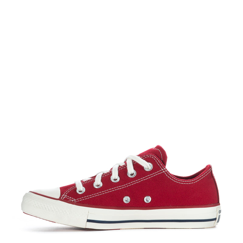 Womens red low-top canvas sneaker with white laces, eyelets, and navy midsole stripe