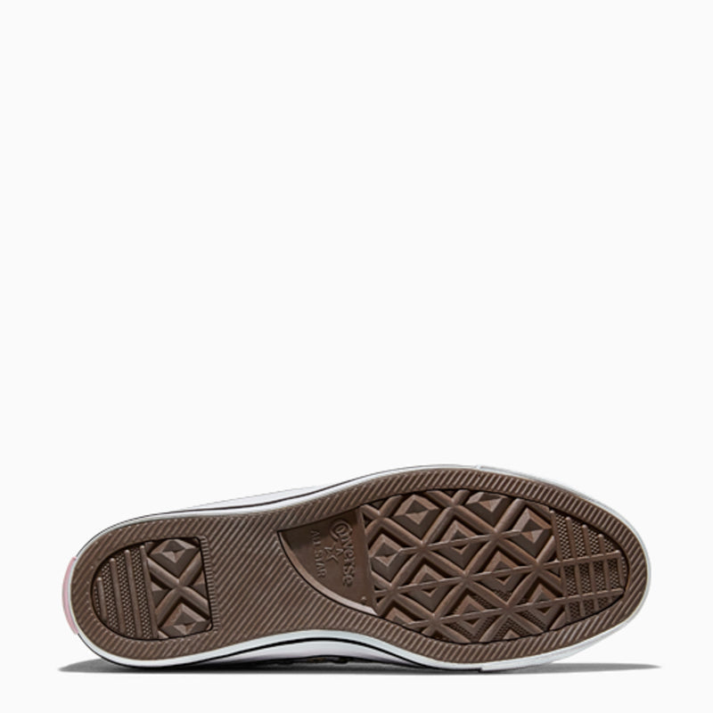 Brown rubber outsole with diamond and cross tread pattern for grip