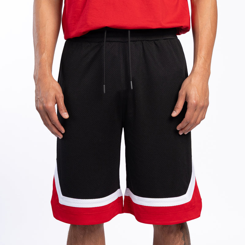 Black basketball shorts with red-and-white side stripe, drawstring waist, side pockets