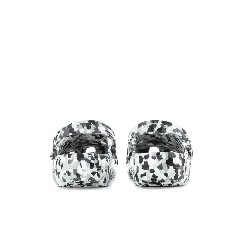 Men's classic clogs in black-and-white confetti animal print, heel view.