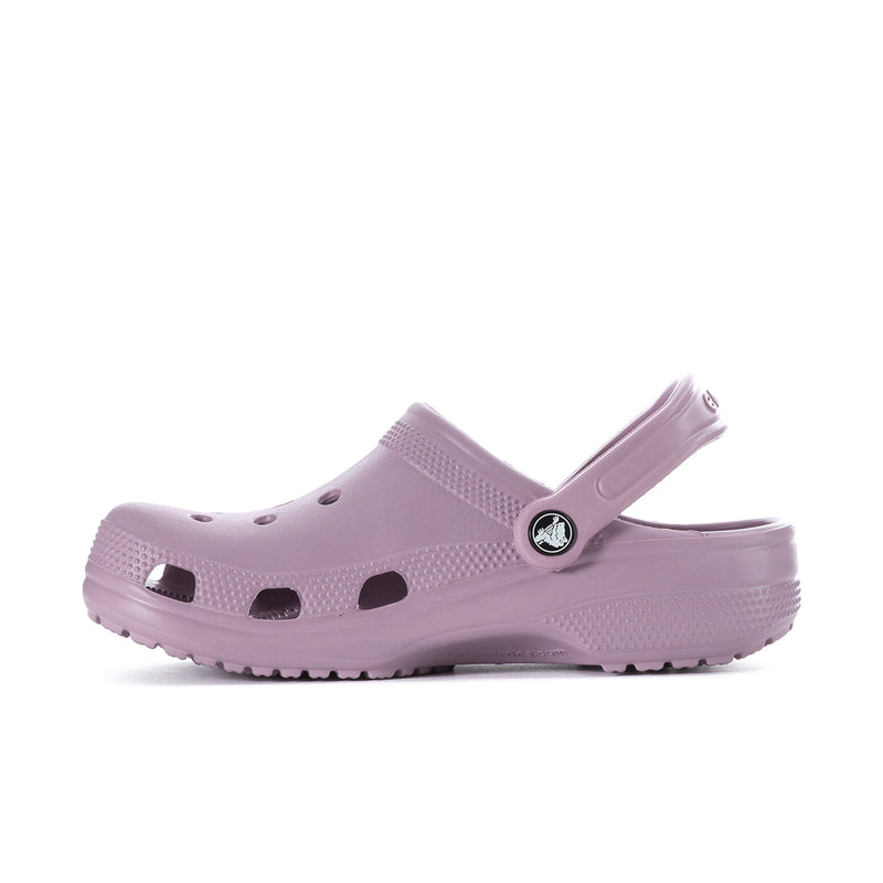 Women's dusty lilac clog side profile with ventilation holes and emblem badge