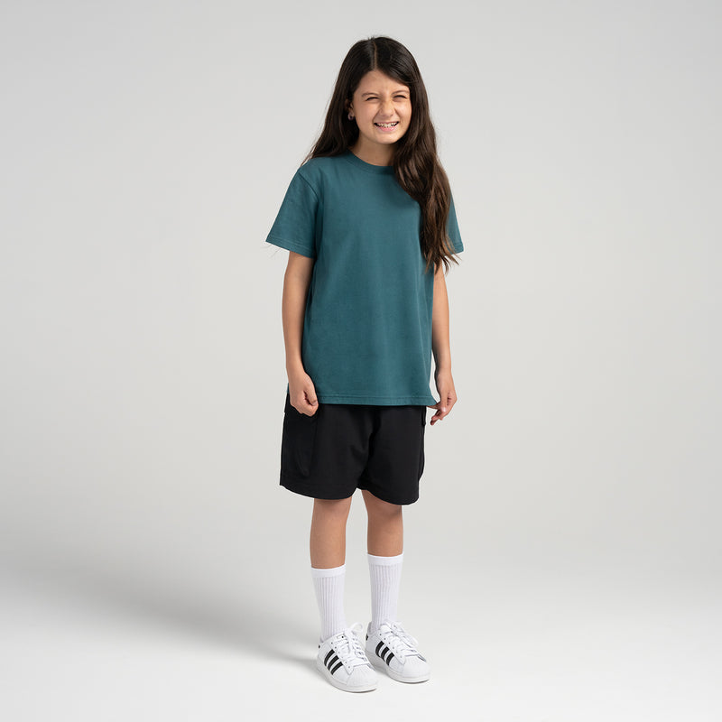 Youth crew-neck T-shirt in dark teal on model, short sleeves