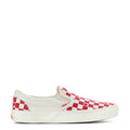 Red and white checkered slip-on sneakers with low canvas profile