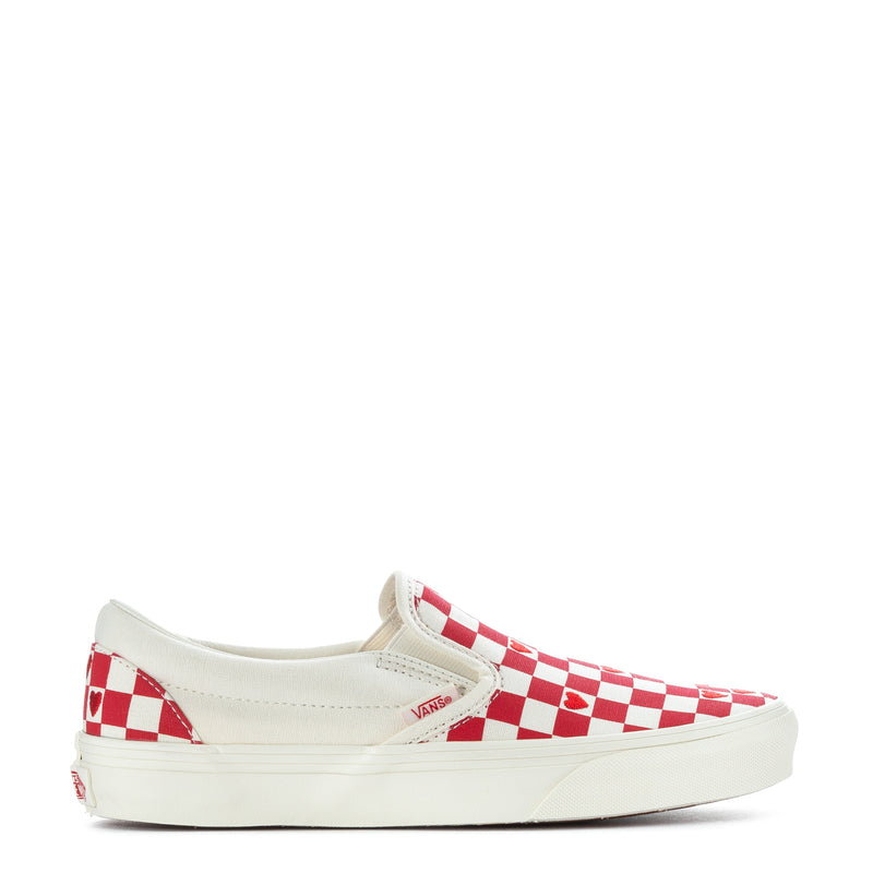 Red and white checkered slip-on sneakers with low canvas profile