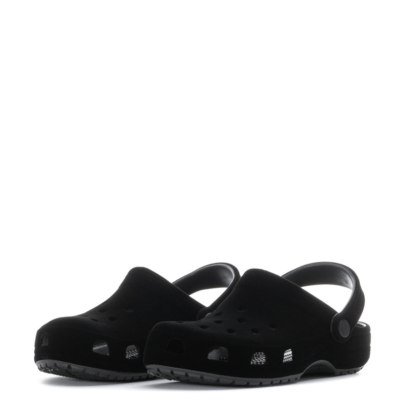 Pair of youth black clogs with heel strap and vented toe design