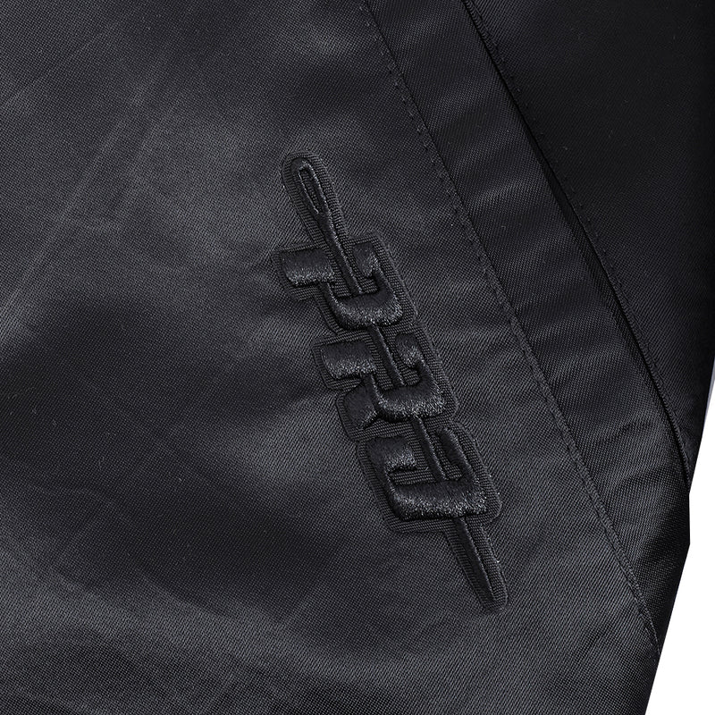 Black satin jacket sleeve with embossed logo near cuff.