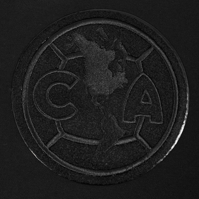 Close-up of black circular embroidered crest patch