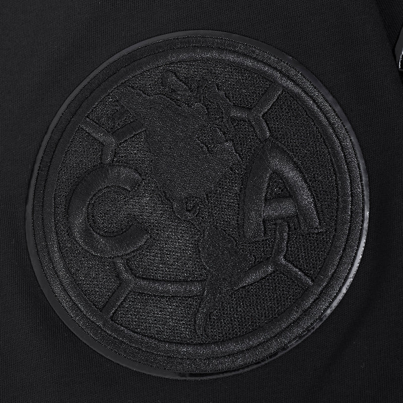 Triple black crew-neck T-shirt chest close-up of circular embossed logo