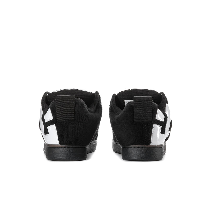 Men's DC low-top skate shoes, black heel with white side logos and back strap