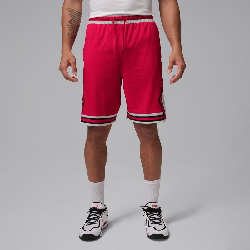 Red men’s basketball shorts with elastic waistband and striped cuffs