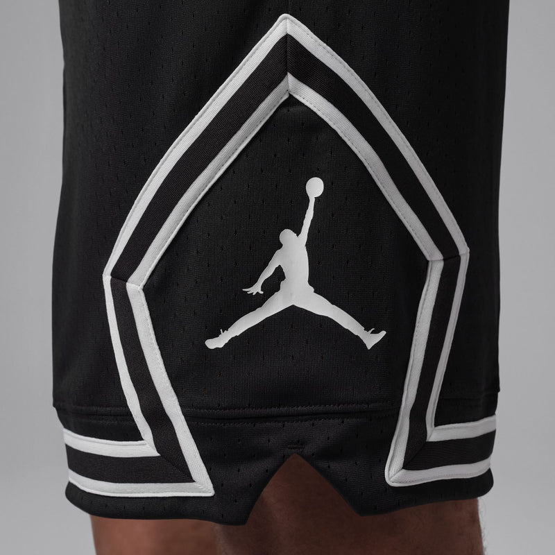 Black basketball shorts with white chevron side panel and Jordan-style logo