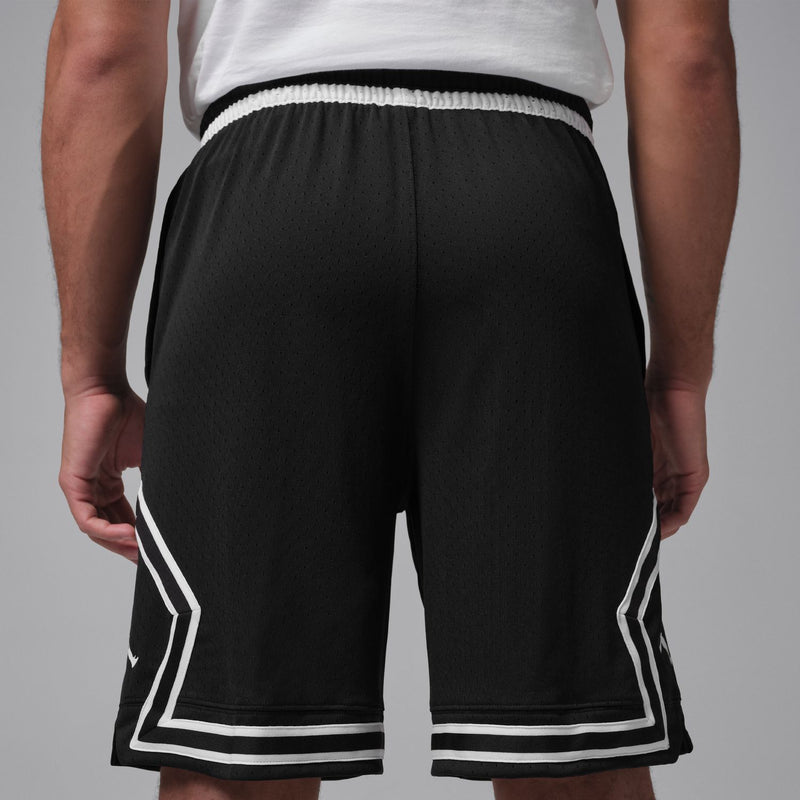Men's black basketball shorts with white striped trim at hem and side panels