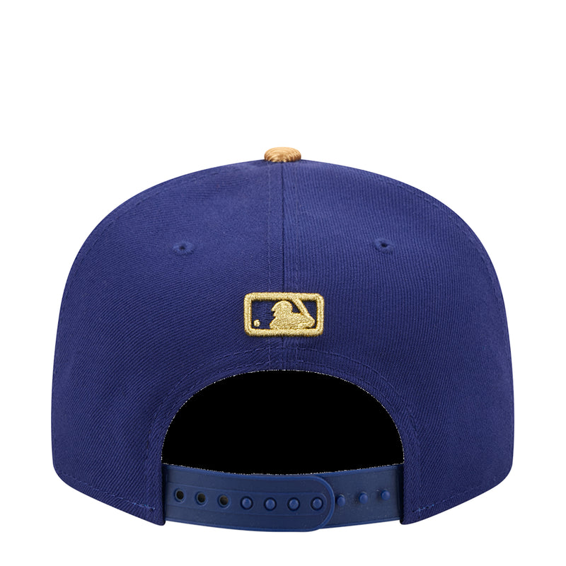 Navy baseball cap with gold New Era logo on back and adjustable strap