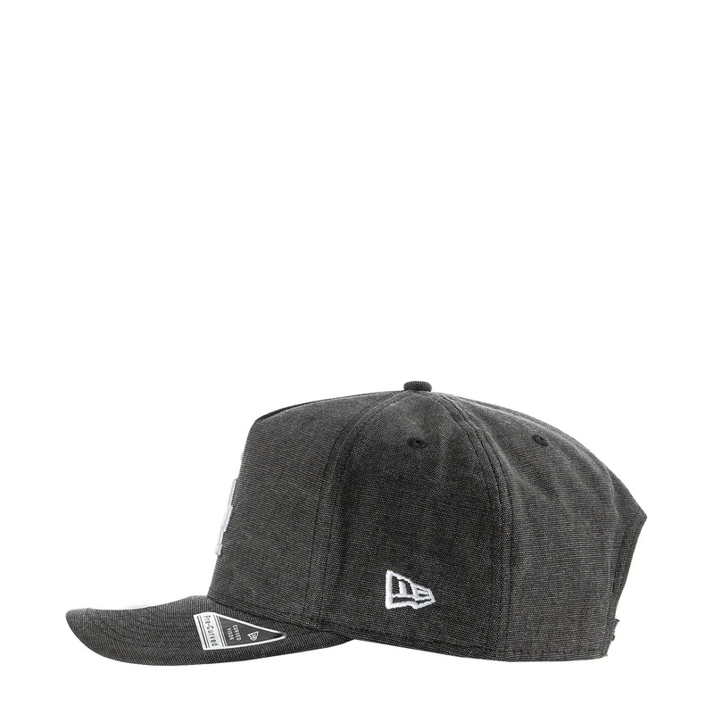 Washed black denim baseball cap with New Era flag logo on side