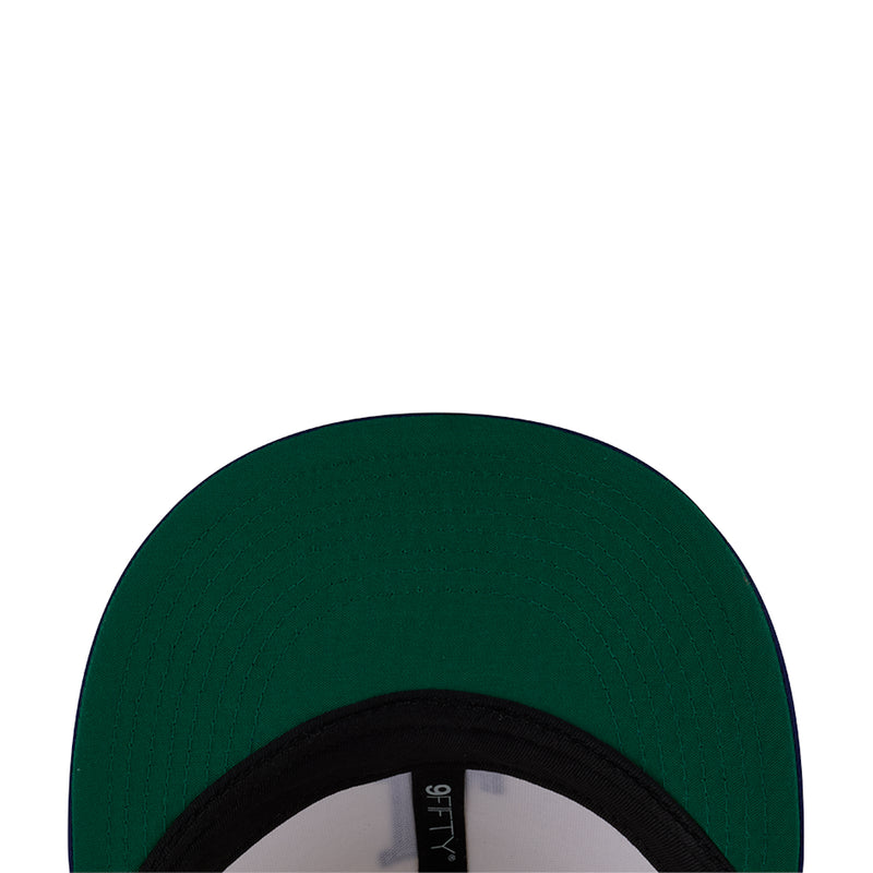 Dark green cap with black inner brim and visible fabric edge.